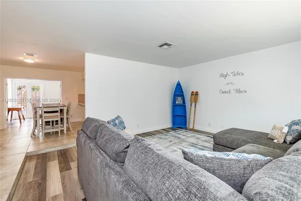 a bedroom with a large bed and a couch