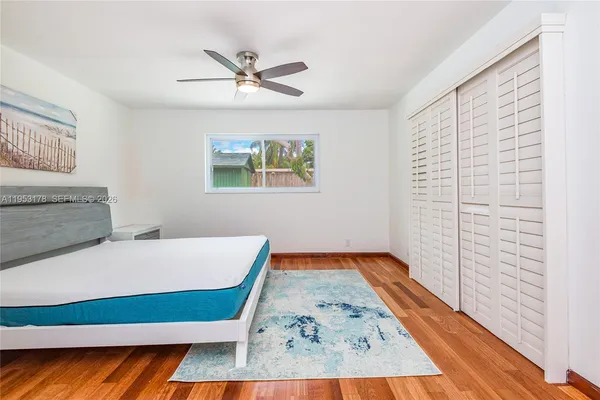 a bedroom with a bed and a dresser