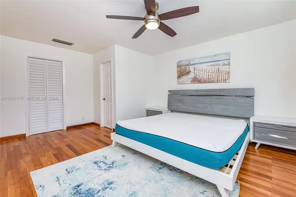 a bedroom with a bed and a dresser