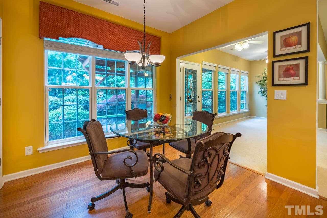 3400 Cathedral Bell Road Raleigh, NC 27614 - Photo 11 of 26 a view of a dining room with furniture window and wooden floor