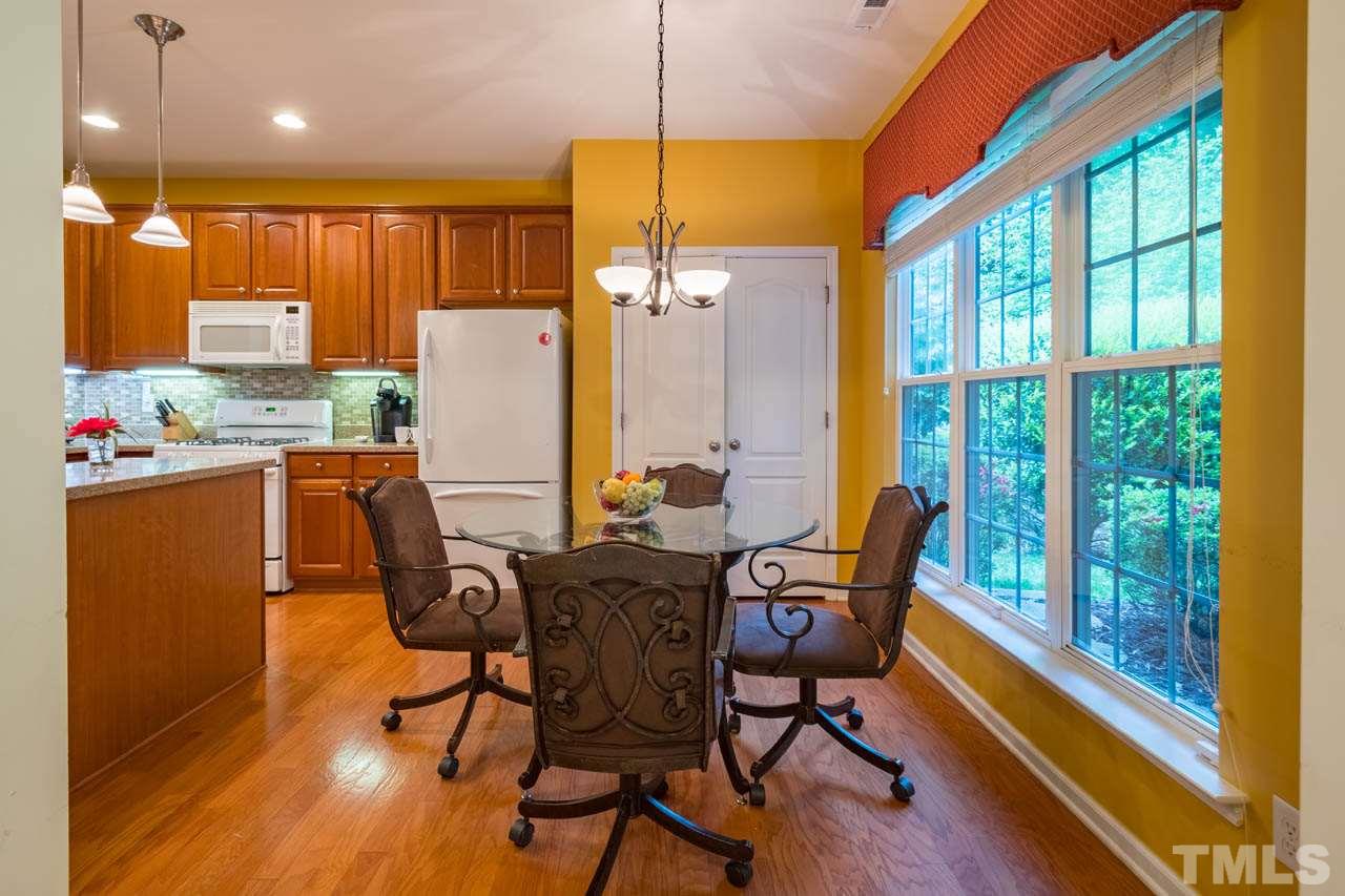 3400 Cathedral Bell Road Raleigh, NC 27614 - Photo 12 of 26 a view of a dining room with furniture and a window