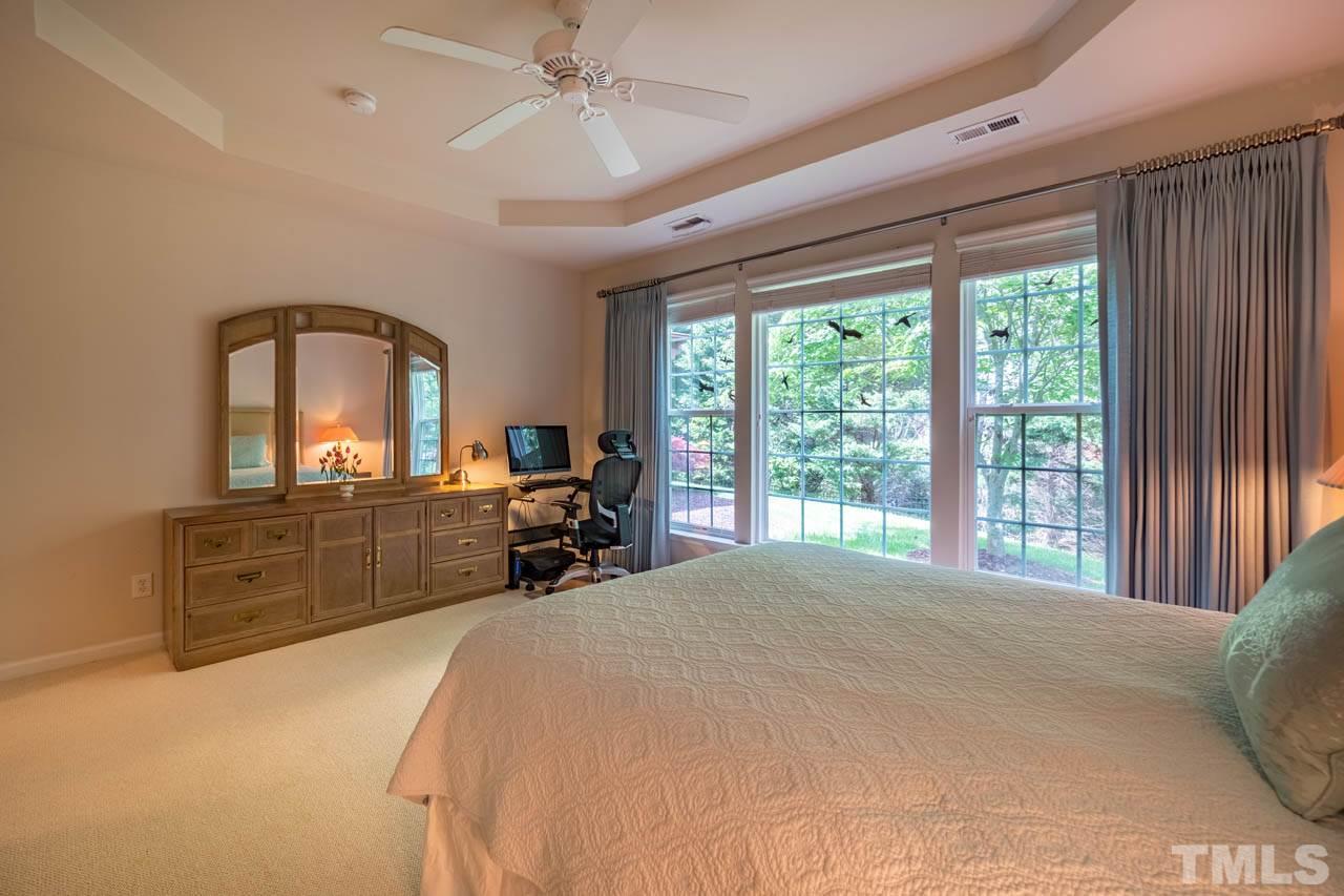 3400 Cathedral Bell Road Raleigh, NC 27614 - Photo 15 of 26 a large bedroom with a bed and a large window with the balcony view