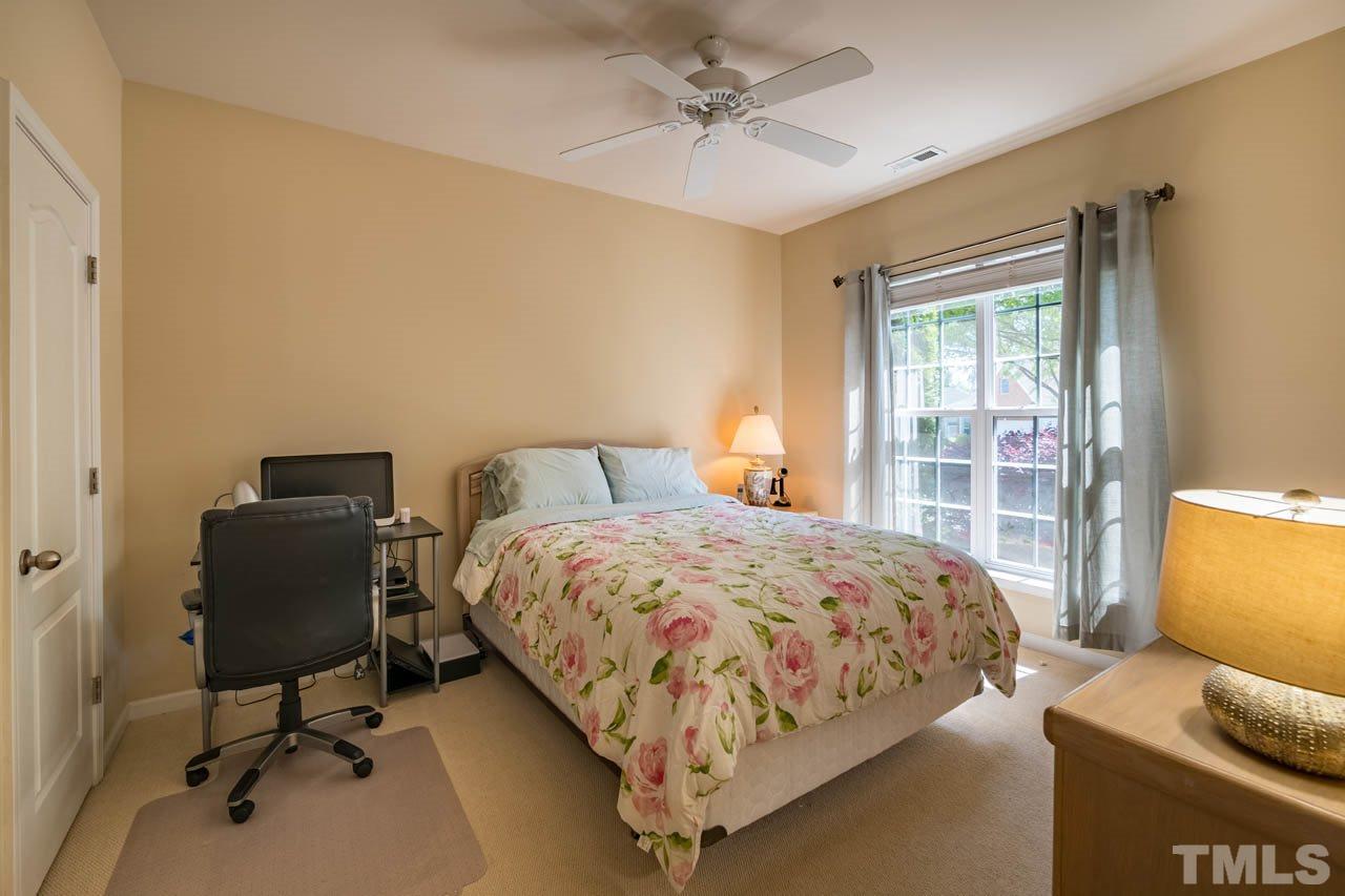 3400 Cathedral Bell Road Raleigh, NC 27614 - Photo 19 of 26 a bedroom with a bed and a window
