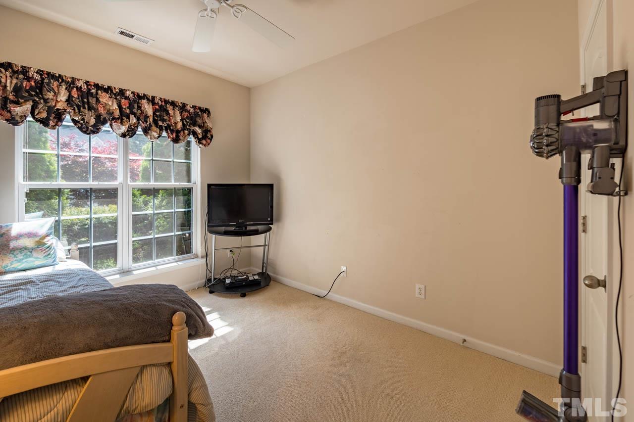 3400 Cathedral Bell Road Raleigh, NC 27614 - Photo 20 of 26 a bedroom with a bed and a window