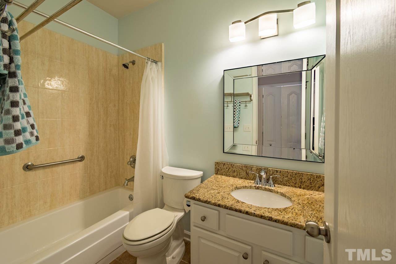 3400 Cathedral Bell Road Raleigh, NC 27614 - Photo 21 of 26 a bathroom with a granite countertop sink toilet and shower