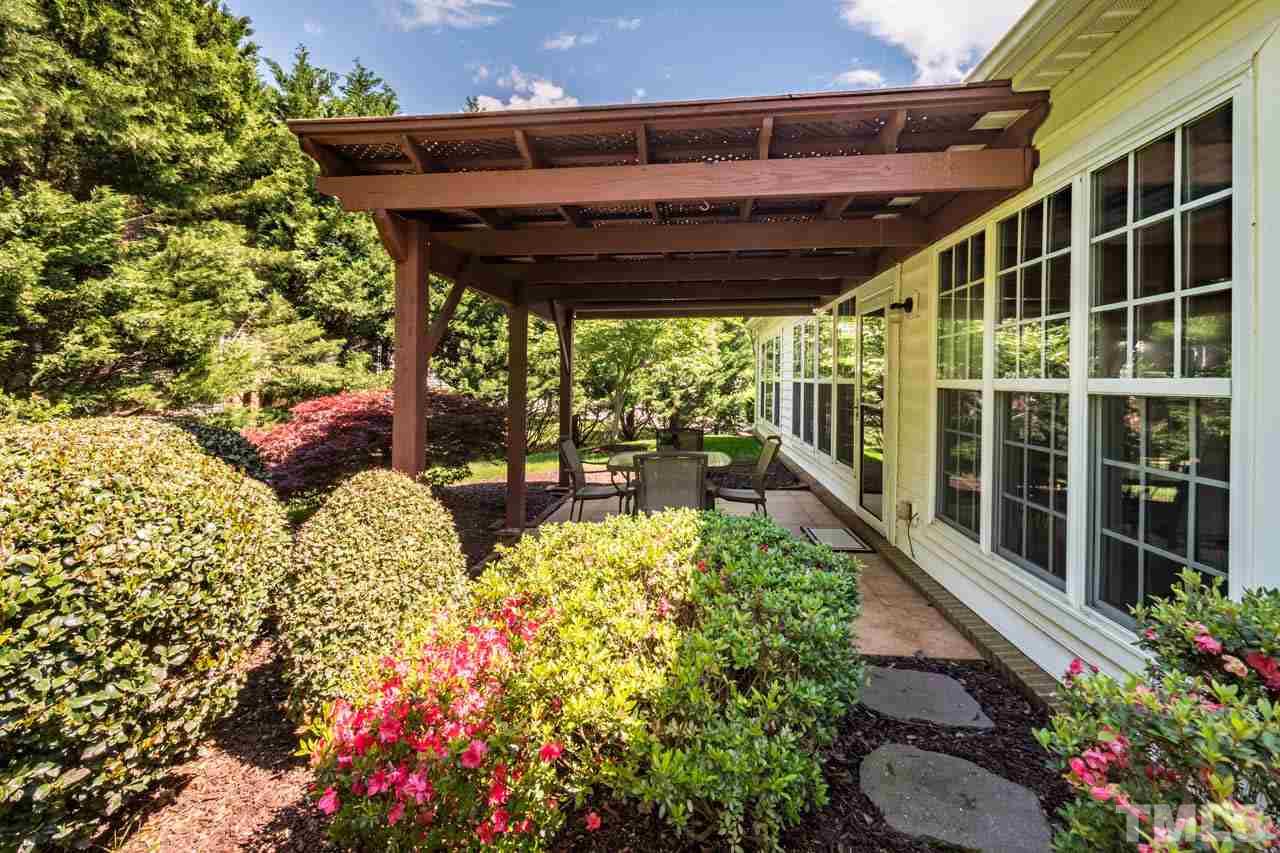3400 Cathedral Bell Road Raleigh, NC 27614 - Photo 22 of 26 a view of a patio with table and chairs and potted plants