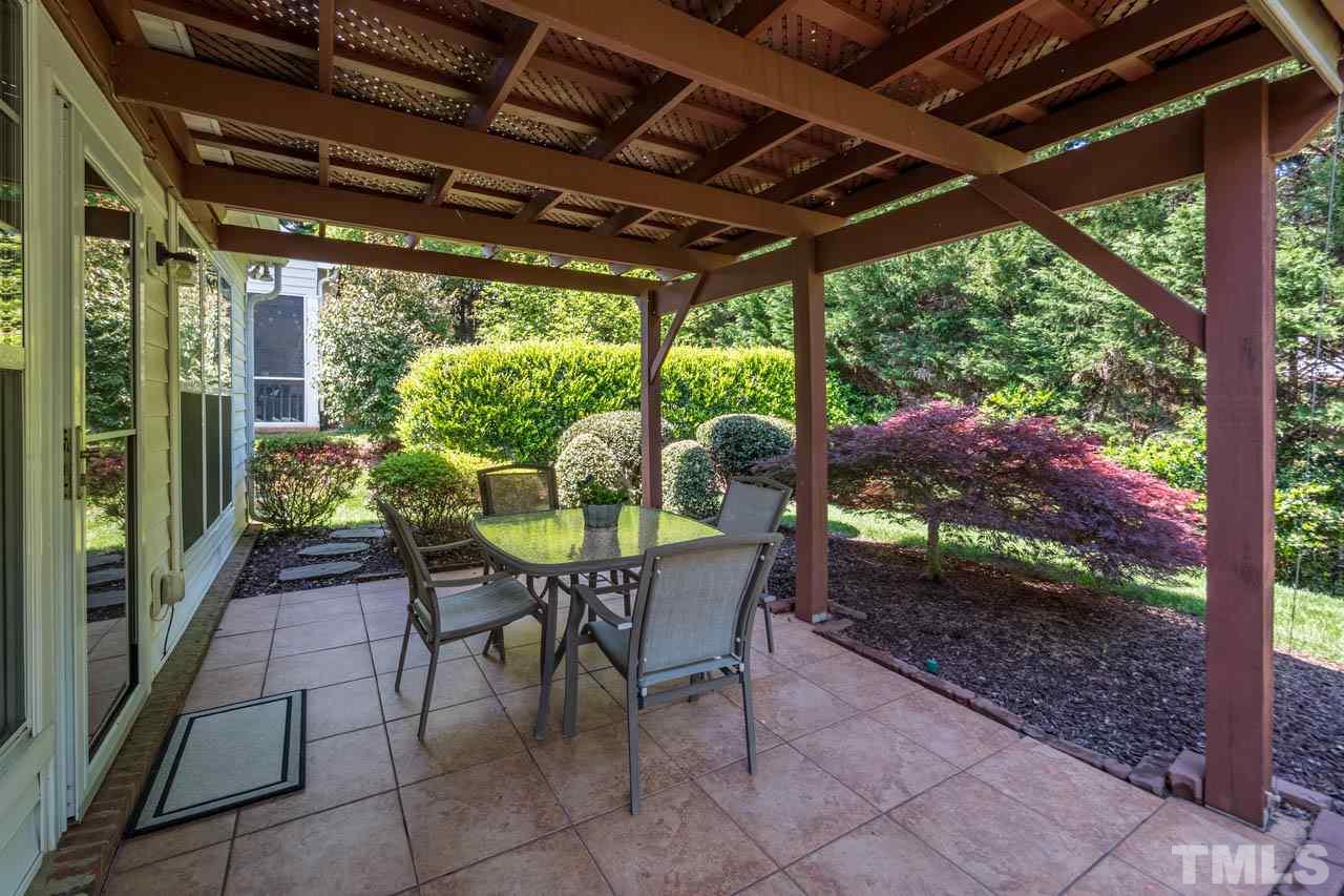 3400 Cathedral Bell Road Raleigh, NC 27614 - Photo 24 of 26 a view of a porch with furniture and a backyard
