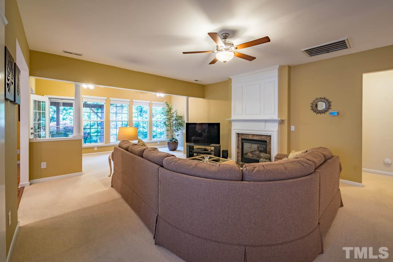 3400 Cathedral Bell Road Raleigh, NC 27614 - Photo 5 of 26 a living room with fireplace furniture and a flat screen tv