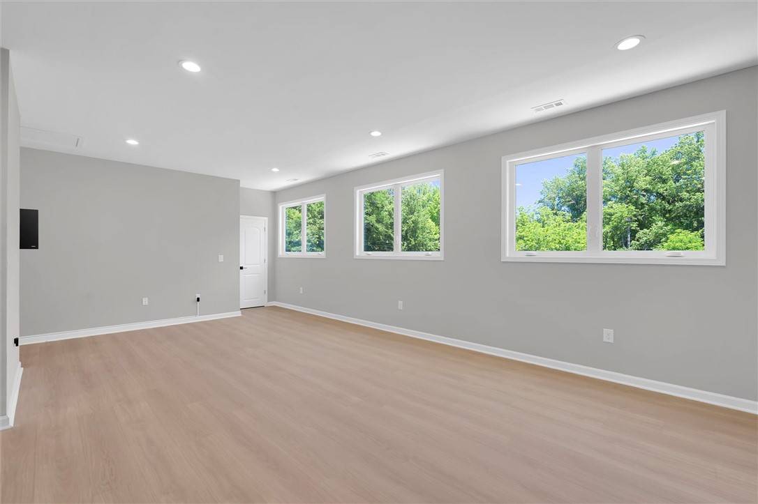 159 Cherokee Trail Easley, SC 29640 - Photo 10 of 38 Ample natural light illuminates this spacious living area with serene tree views.