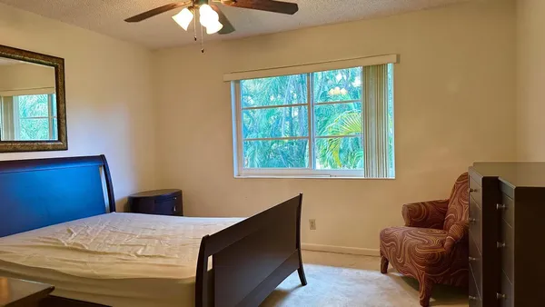 a bed room with a bed and a window