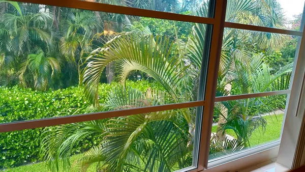 a view of a garden from a balcony
