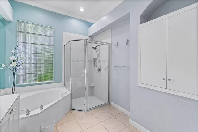 a bathroom with a shower and a bathtub