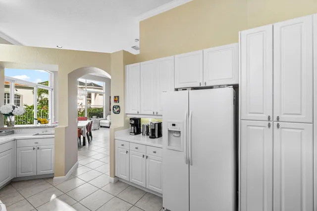 a kitchen with cabinets and window