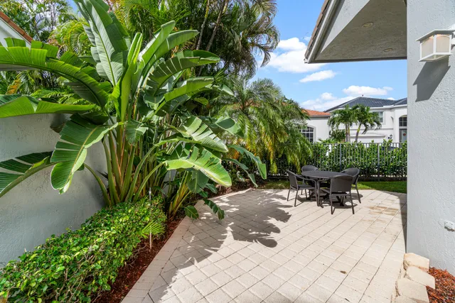 a view of a backyard with sitting area