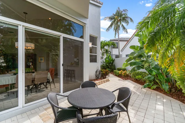a outdoor space with a table and chairs