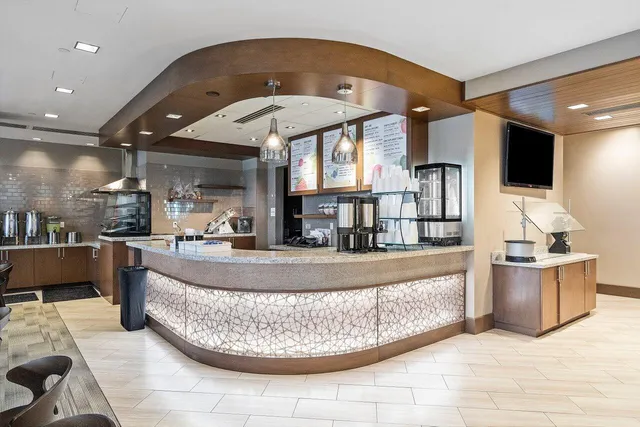 a view of a living room and kitchen
