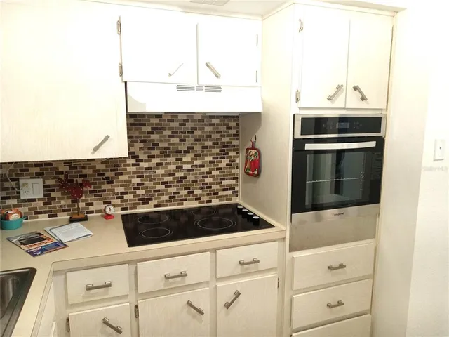 a bathroom with a stove and a sink
