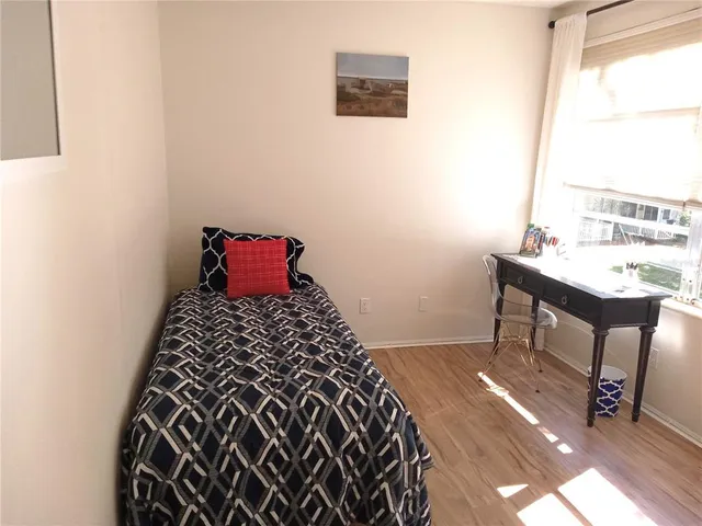 a bathroom with a sink toilet and mirror