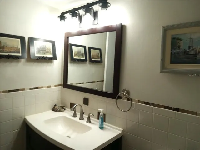 a white toilet sitting next to a bath tub