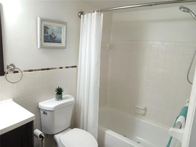 a view of a swimming pool with an outdoor space and seating area