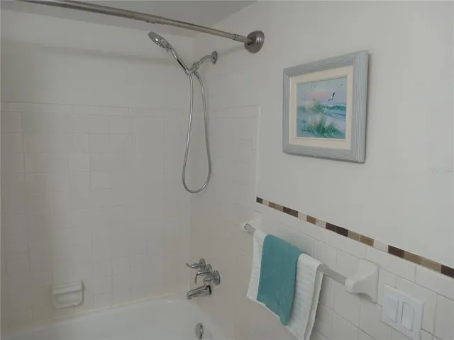 a view of a house with a yard and porch