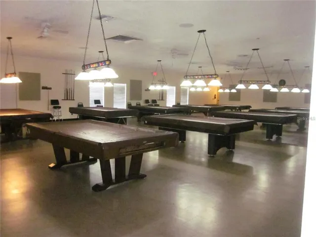 a view of a dining room with furniture and a table