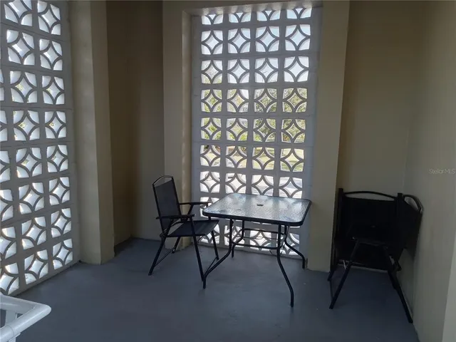 a view of a livingroom with furniture window and wooden floor