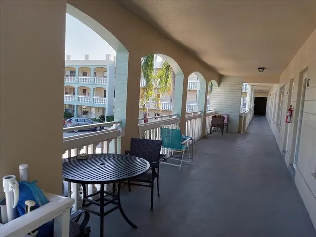 a view of a room with furniture and wooden floor