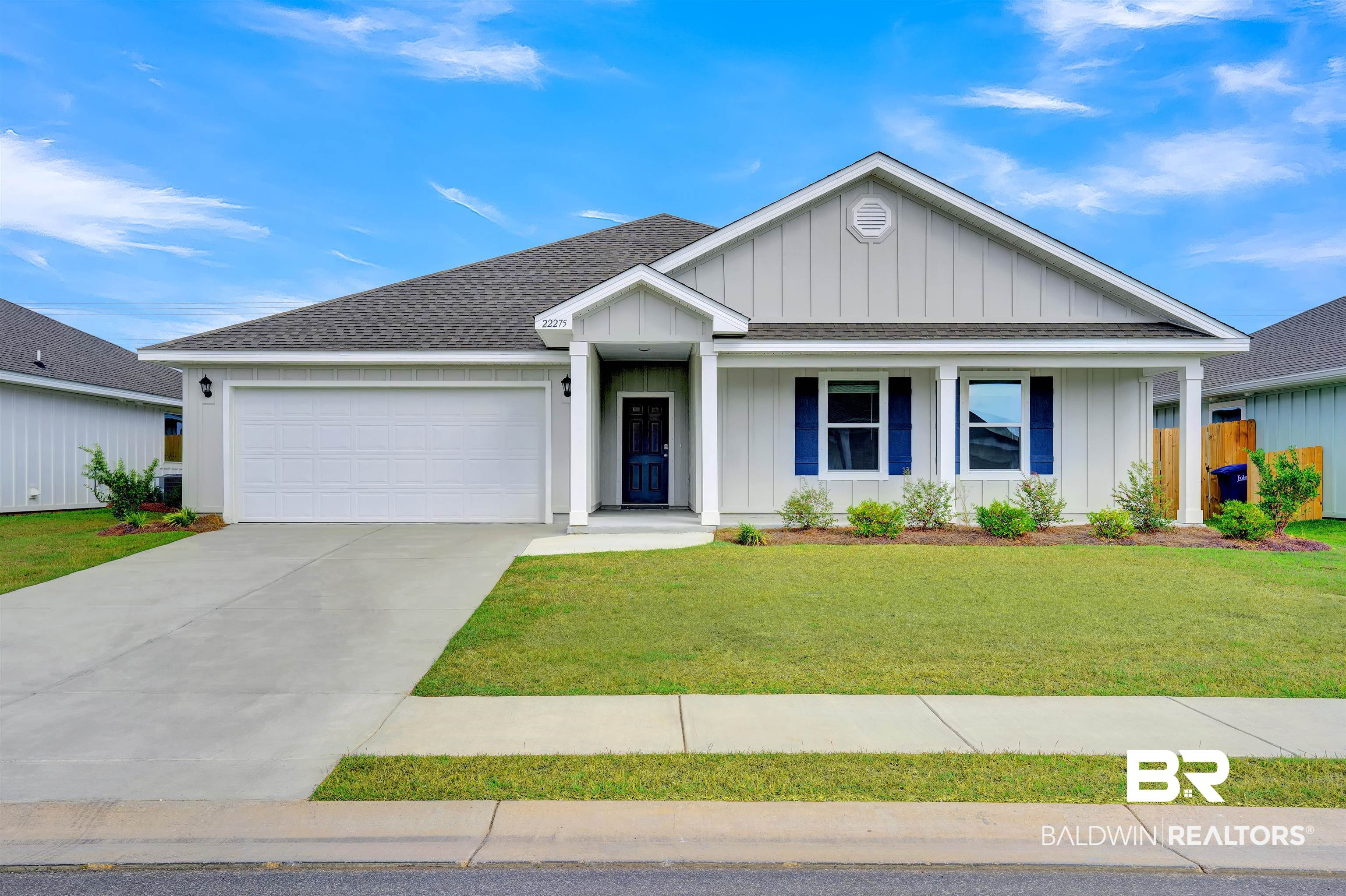 22275 Aleutian Avenue Foley, AL 36535 - Photo 1 of 72 View of front facade with a garage and a front lawn