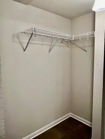 a view of a room with racks on the wall