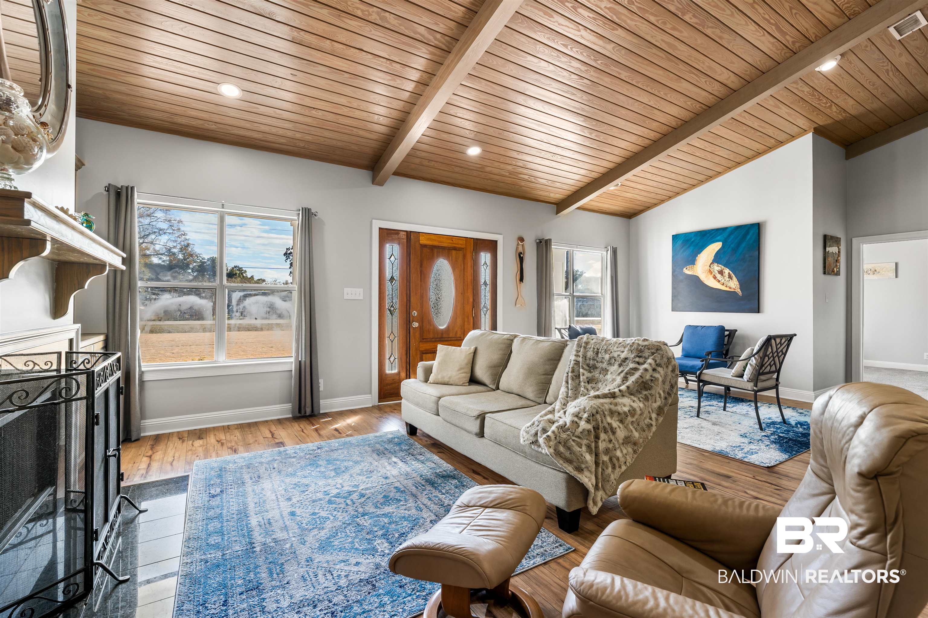 19079 Baldwin County Road 10 Foley, AL 36535 - Photo 28 of 37 Living room featuring vaulted ceiling with beams, light wood-type flooring, recessed lighting, a fireplace with flush hearth, and wood ceiling