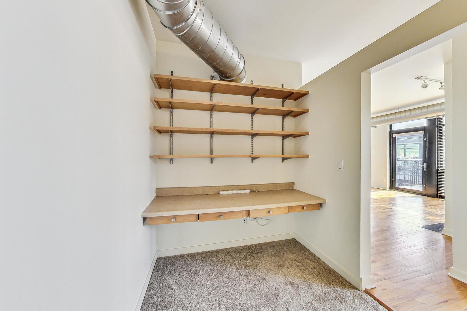1151 West 14th Place, Unit 404 Chicago, IL 60608 - Photo 16 of 28 a view of staircase with white walls
