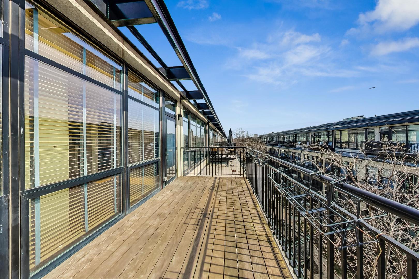 1151 West 14th Place, Unit 404 Chicago, IL 60608 - Photo 19 of 28 a view of balcony with wooden floor