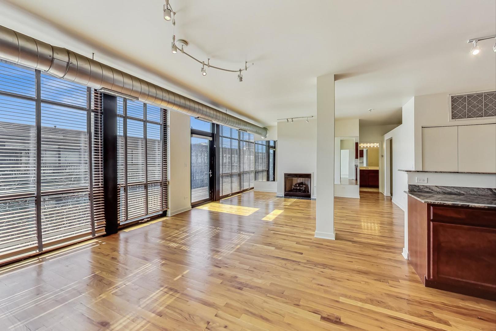 1151 West 14th Place, Unit 404 Chicago, IL 60608 - Photo 2 of 28 a view of an entryway with wooden floor