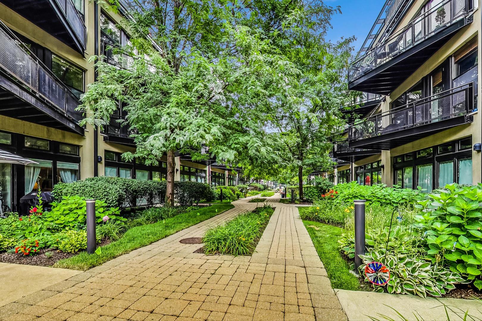 1151 West 14th Place, Unit 404 Chicago, IL 60608 - Photo 26 of 28 a view of a pathway with a house