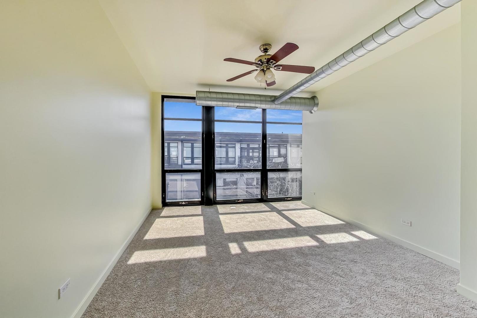 1151 West 14th Place, Unit 404 Chicago, IL 60608 - Photo 10 of 28 a view of an empty room with a window