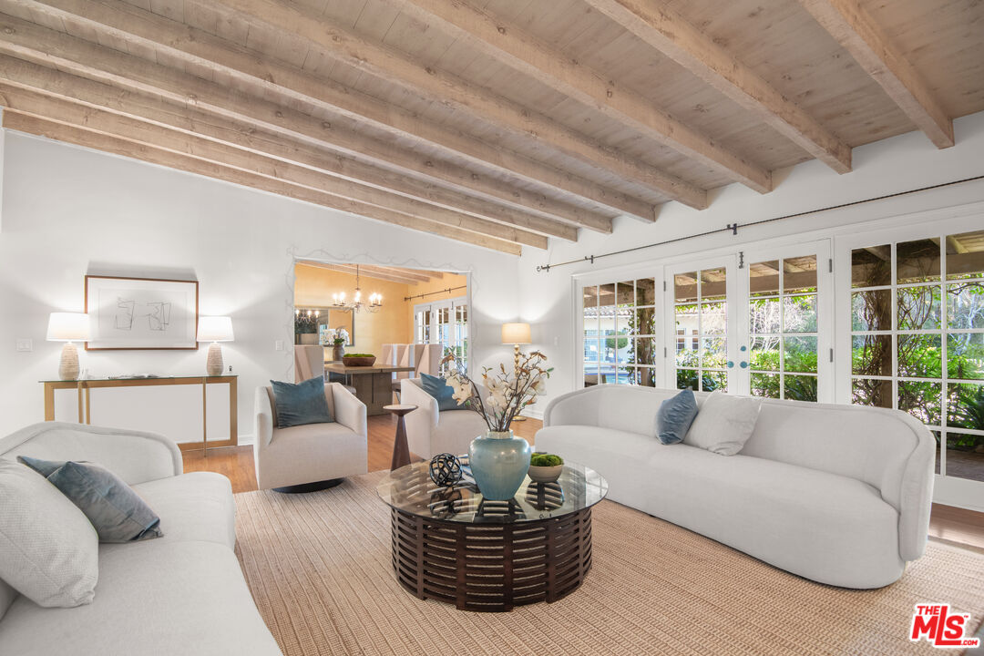 6105 Bonsall Drive Malibu, CA 90265 - Photo 1 of 45 a living room with furniture and a large window