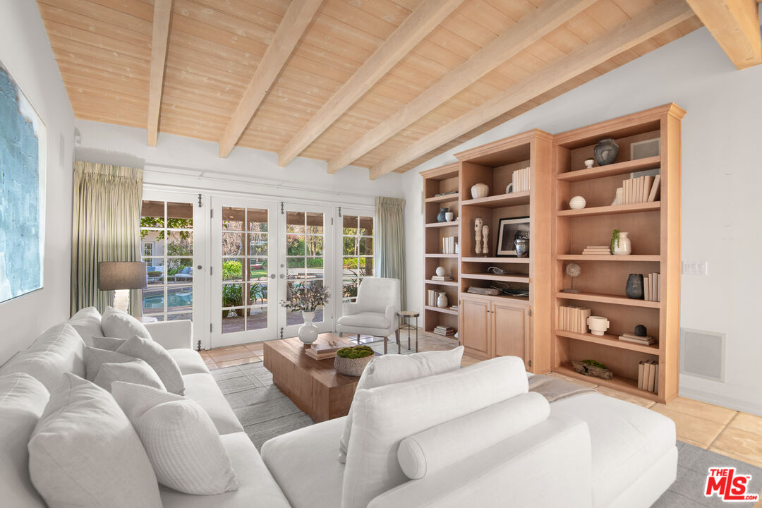 6105 Bonsall Drive Malibu, CA 90265 - Photo 14 of 45 a living room with furniture cabinets and a flat screen tv