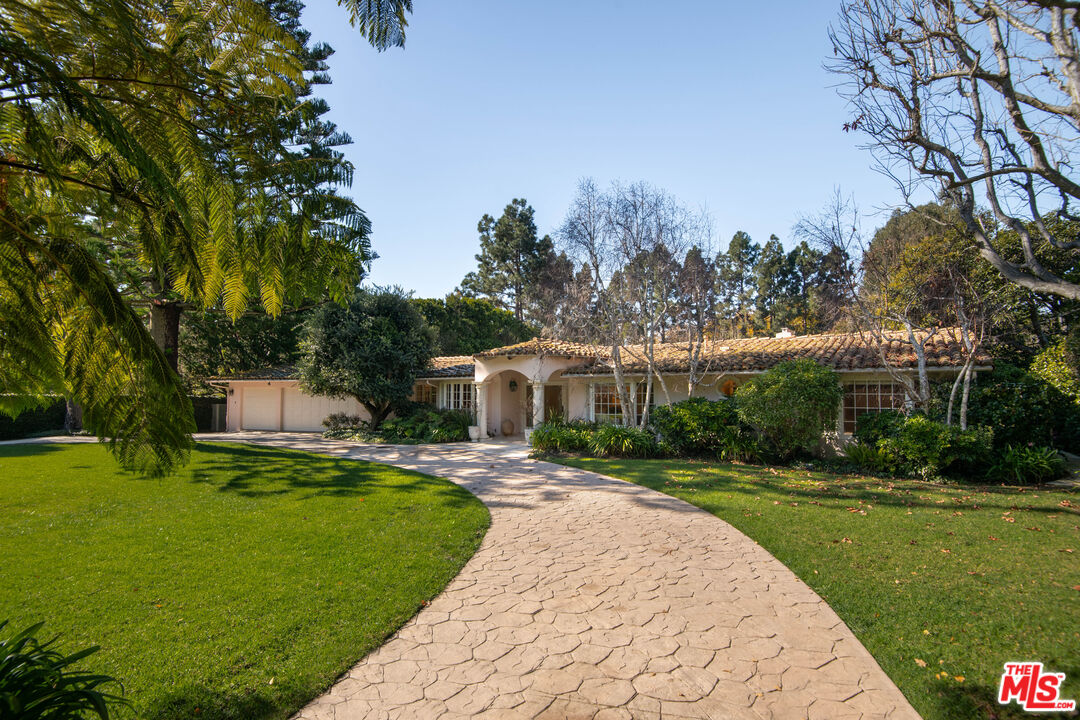 6105 Bonsall Drive Malibu, CA 90265 - Photo 2 of 45 a front view of a house with a garden and trees