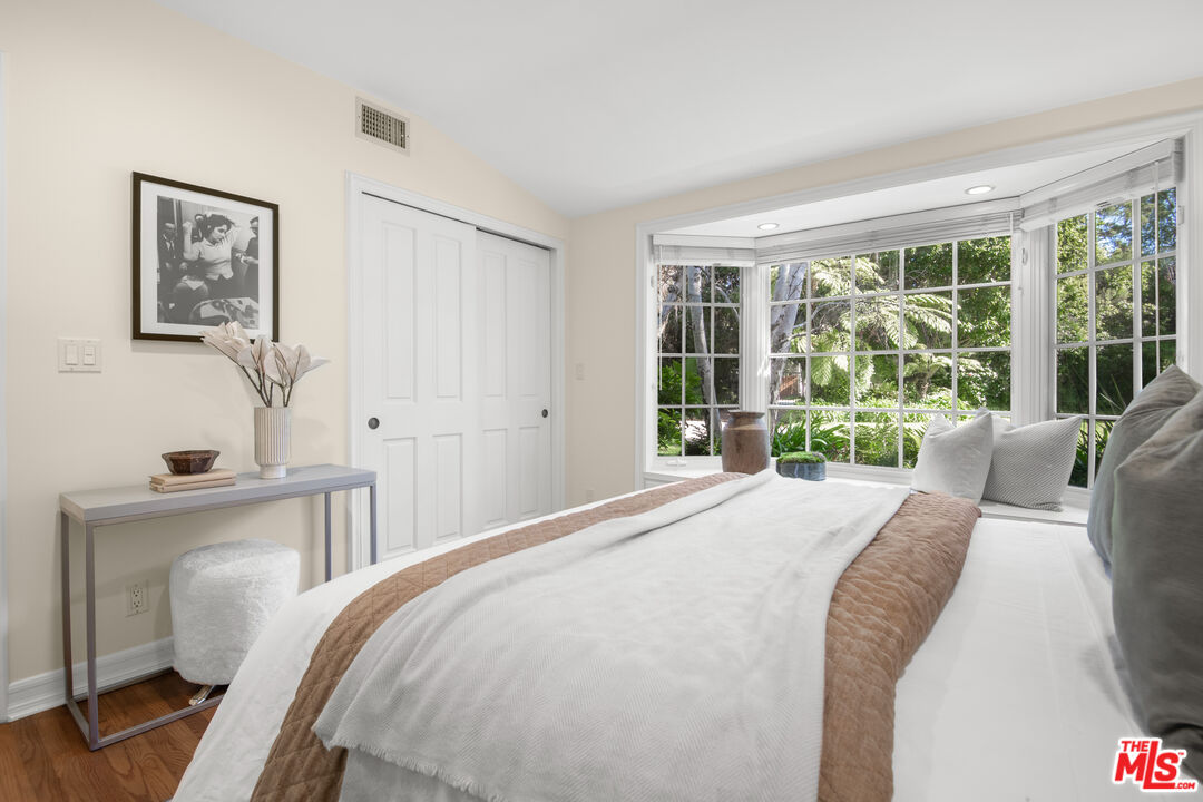 6105 Bonsall Drive Malibu, CA 90265 - Photo 24 of 45 a bedroom with a bed and a large window