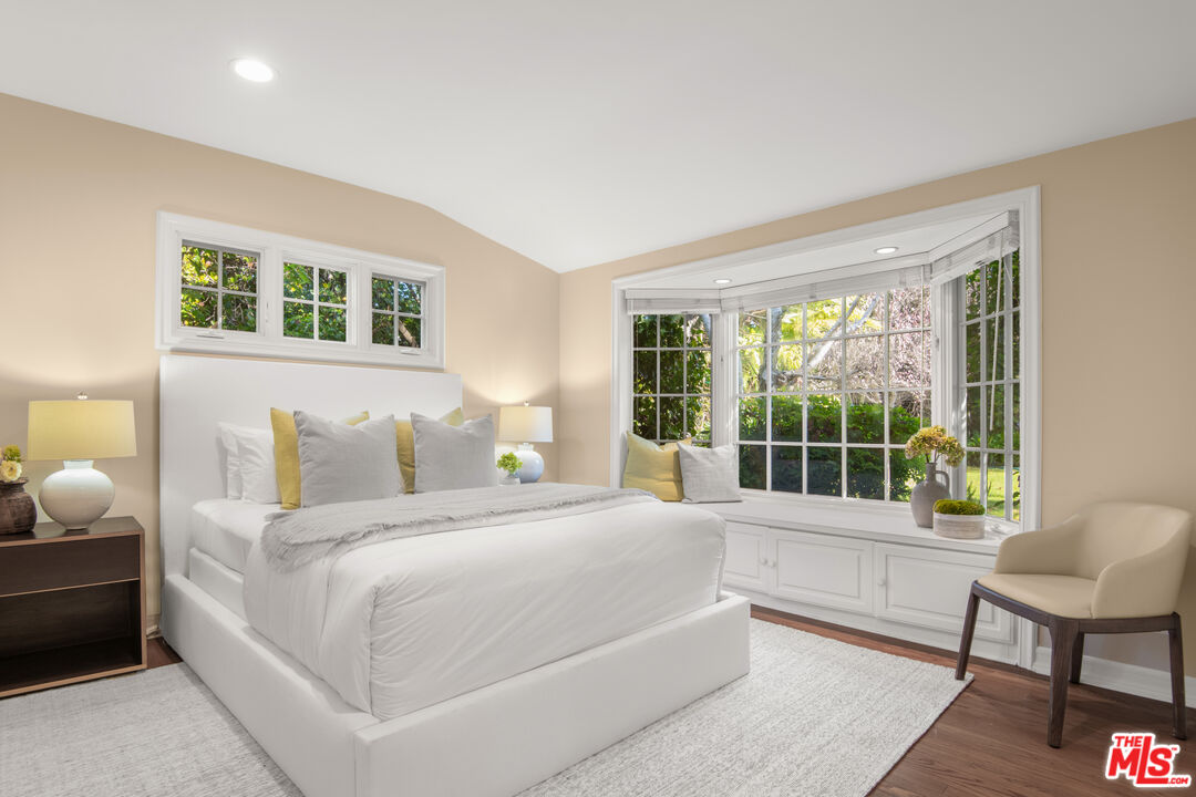 6105 Bonsall Drive Malibu, CA 90265 - Photo 26 of 45 a bedroom with a bed and a large window