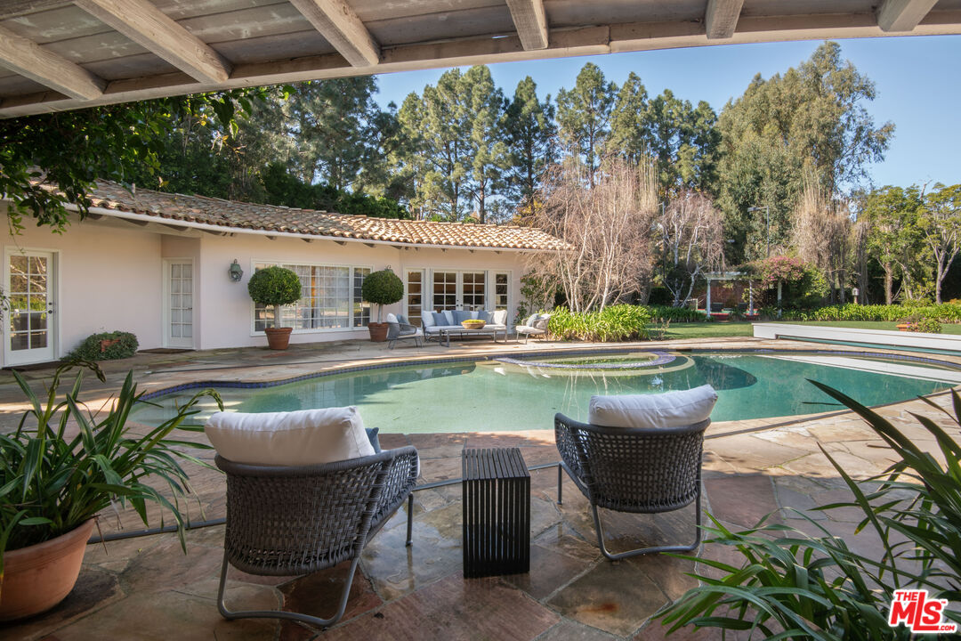 6105 Bonsall Drive Malibu, CA 90265 - Photo 27 of 45 a swimming pool with outdoor seating and yard