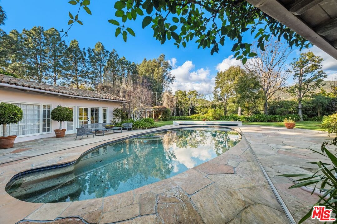 6105 Bonsall Drive Malibu, CA 90265 - Photo 28 of 45 a view of swimming pool with outdoor seating and plants