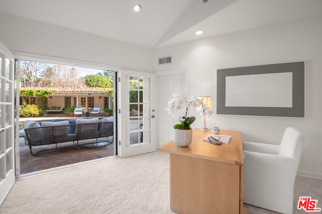6105 Bonsall Drive Malibu, CA 90265 - Photo 31 of 45 a living room with furniture and a floor to ceiling window