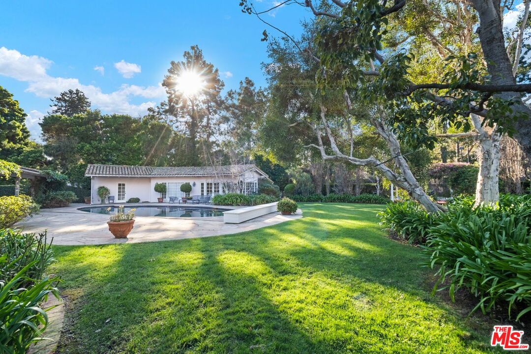 6105 Bonsall Drive Malibu, CA 90265 - Photo 32 of 45 a view of a house with swimming pool and sitting area