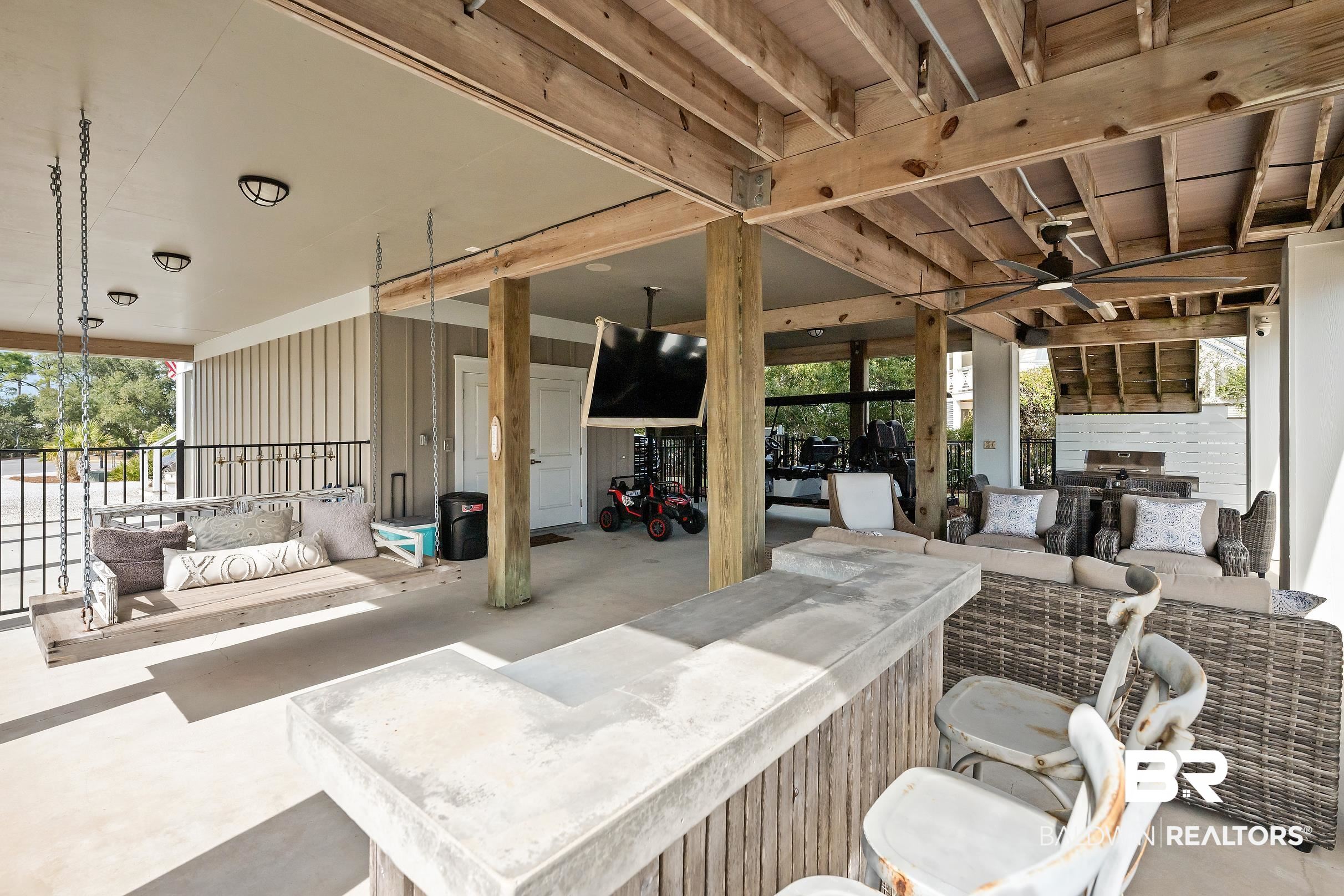 33186 Marlin Key Drive Orange Beach, AL 36561 - Photo 77 of 87 View of patio / terrace featuring ceiling fan, an outdoor lounge area with bar, and exterior kitchen