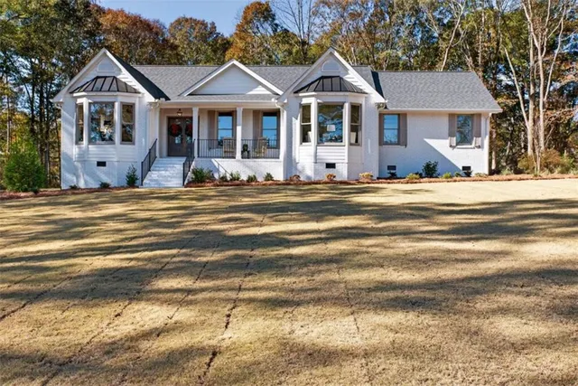 a front view of a house with a yard