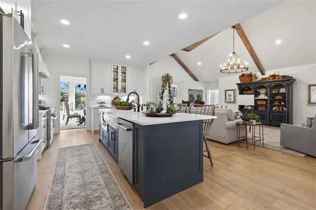 a kitchen with stainless steel appliances granite countertop a lot of counter top space