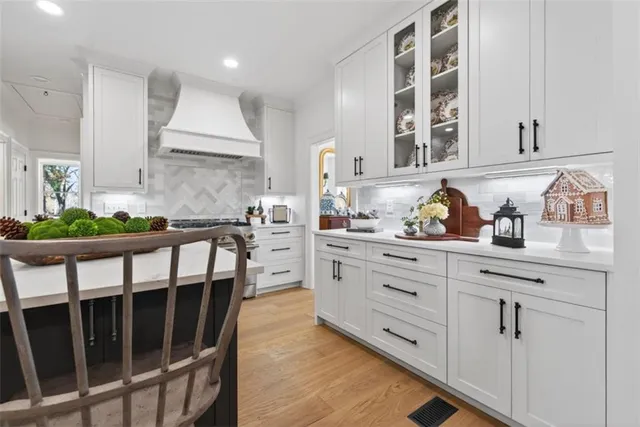 a kitchen with sink cabinets and window