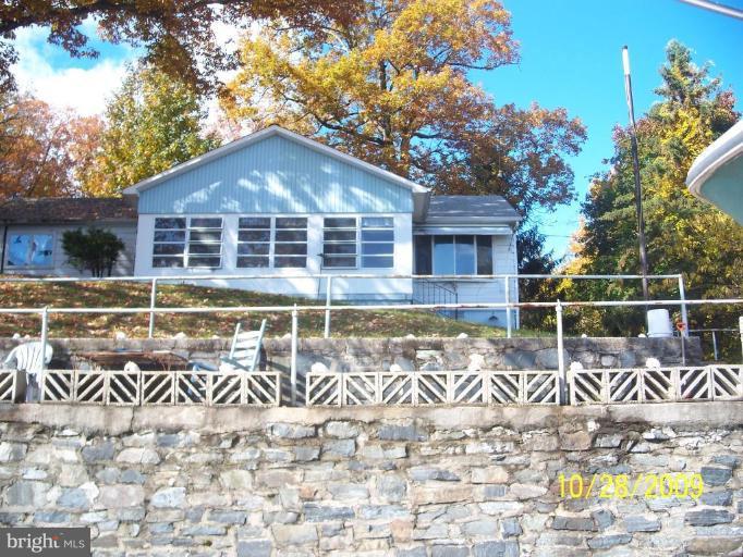 a front view of a house with swimming pool